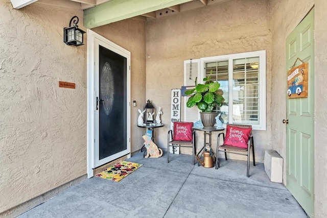 doorway to property with a patio area