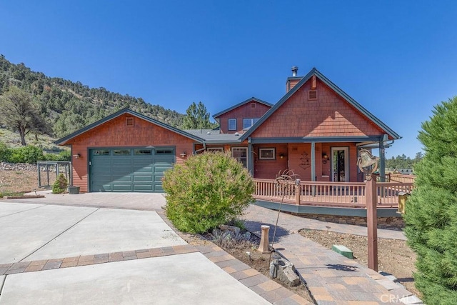 craftsman-style home with covered porch and a garage