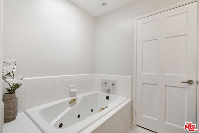 bathroom with tiled bath