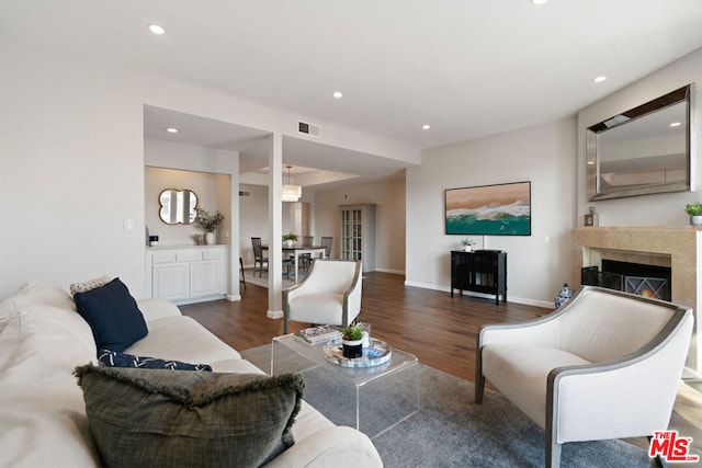 living room with dark hardwood / wood-style flooring