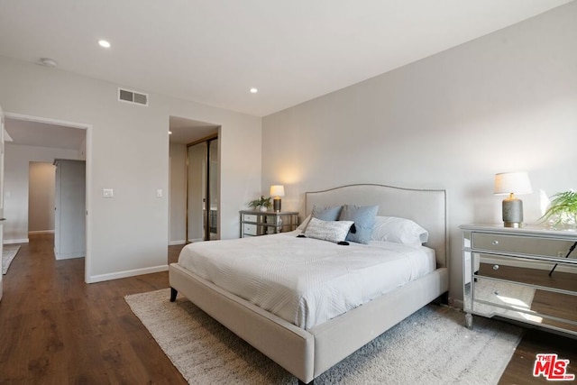 bedroom featuring dark hardwood / wood-style floors