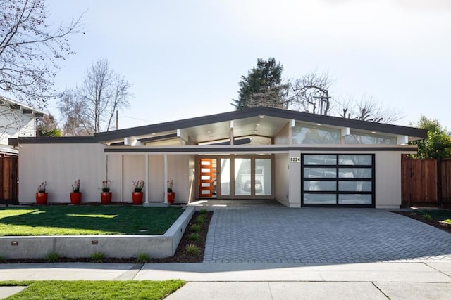 contemporary house featuring a front yard