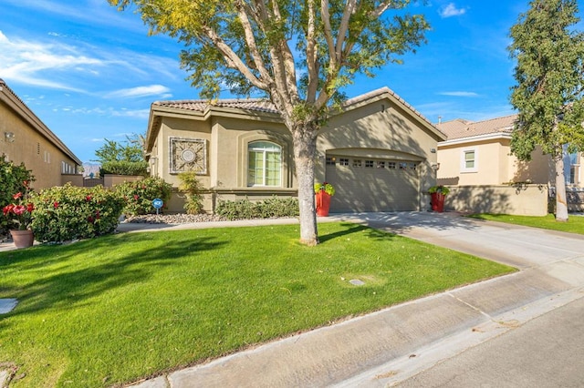 view of front of house featuring a garage and a front lawn