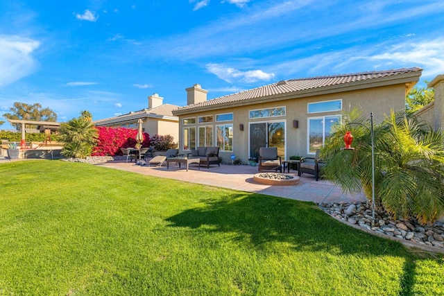 back of house with a patio area, a lawn, and an outdoor living space