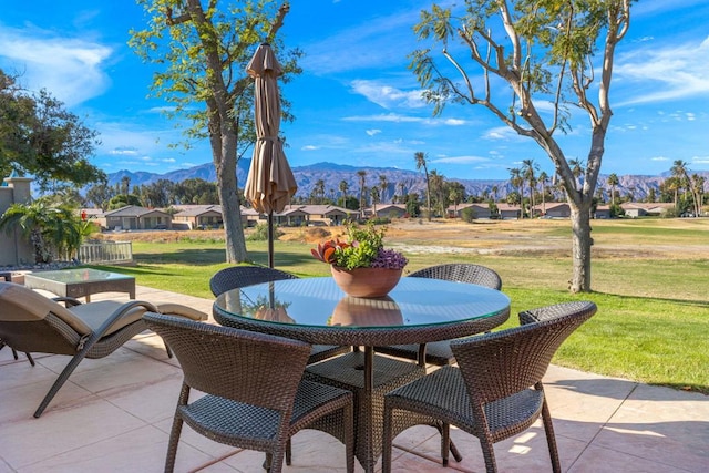 view of patio / terrace featuring a mountain view