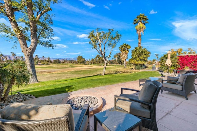 view of patio / terrace featuring an outdoor fire pit