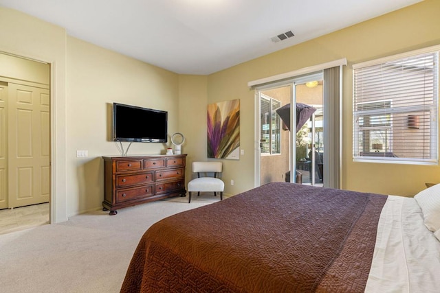 carpeted bedroom featuring access to outside