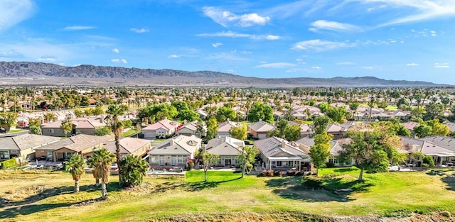 birds eye view of property with a mountain view