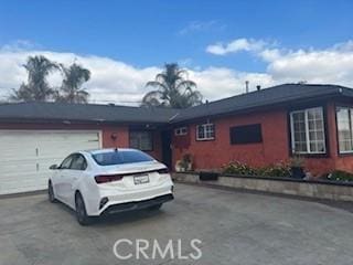 single story home featuring a garage