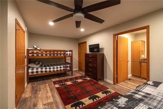 bedroom with hardwood / wood-style flooring and ceiling fan