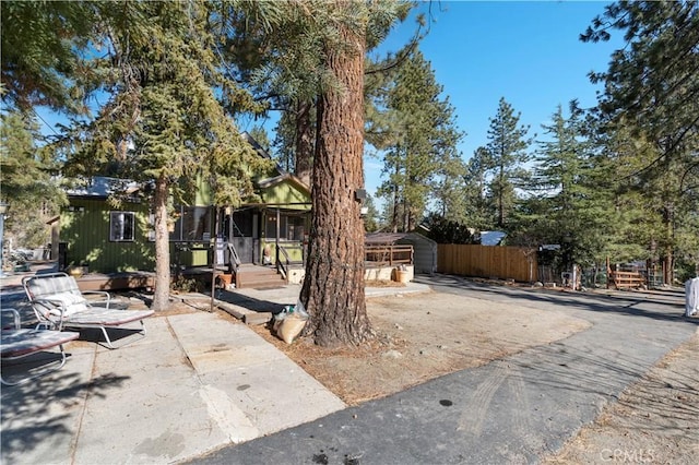 view of property hidden behind natural elements