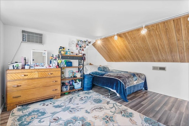 bedroom with wooden ceiling, hardwood / wood-style flooring, and an AC wall unit