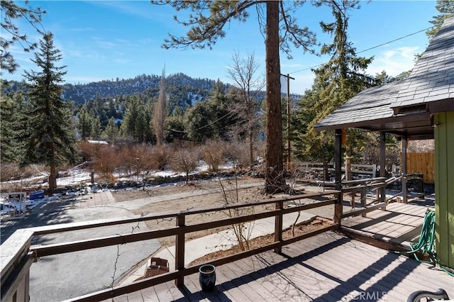 wooden deck featuring a mountain view