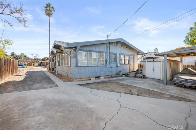 manufactured / mobile home with a patio area and a storage shed