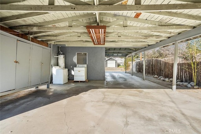 garage featuring washer / dryer and water heater