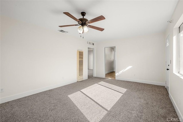 unfurnished bedroom featuring ceiling fan and carpet