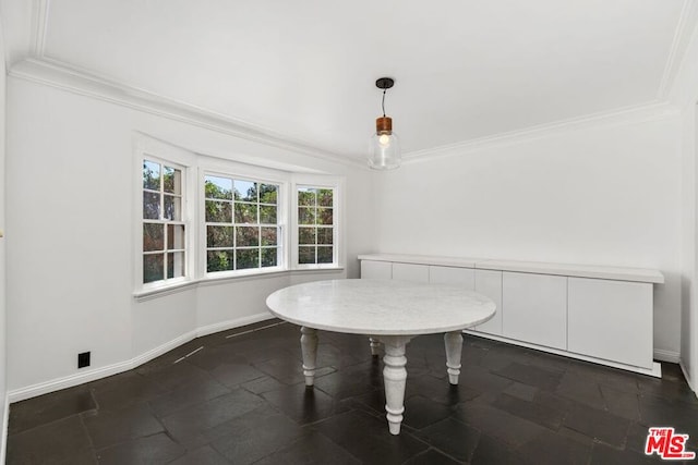 unfurnished dining area featuring crown molding