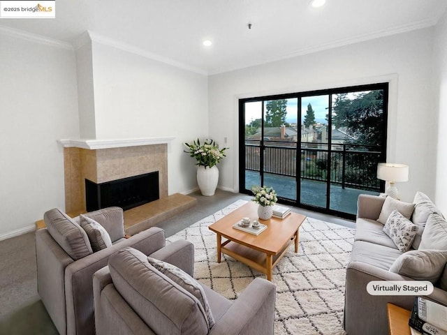 living room with a tiled fireplace and ornamental molding