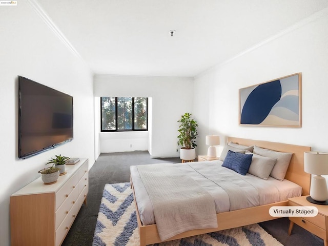 bedroom featuring ornamental molding and dark carpet