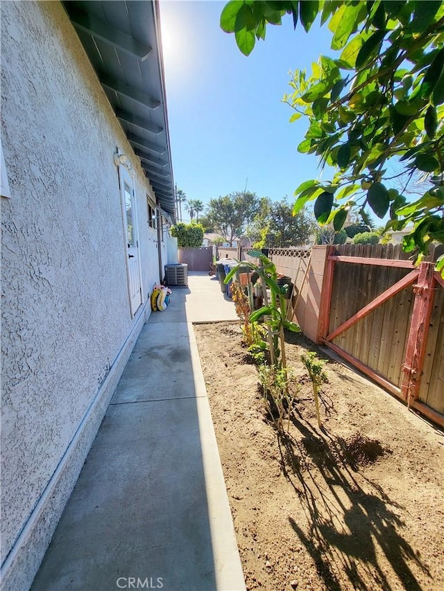 exterior space with a patio area and central AC