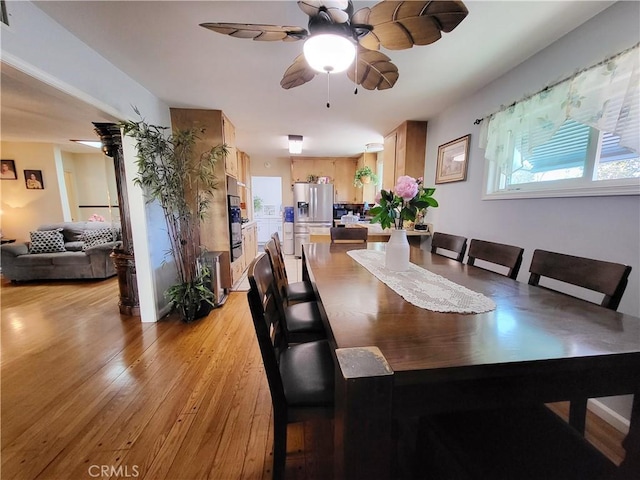 dining space featuring light wood-type flooring