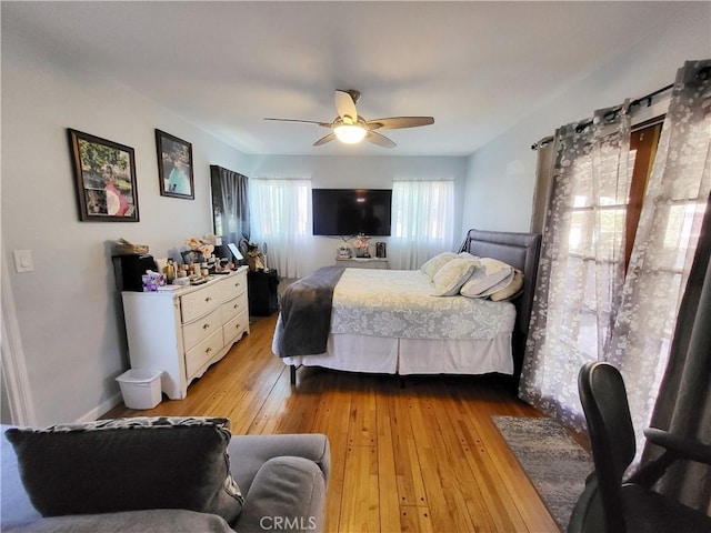 bedroom featuring light wood-type flooring and ceiling fan