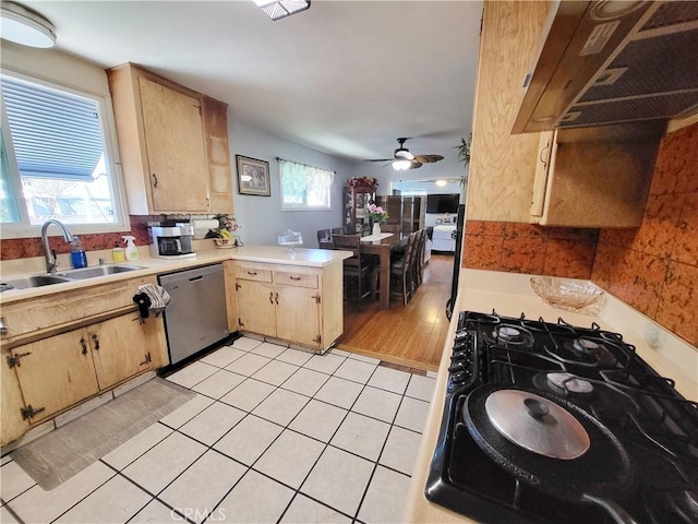 kitchen featuring dishwasher, ceiling fan, plenty of natural light, sink, and light tile patterned flooring