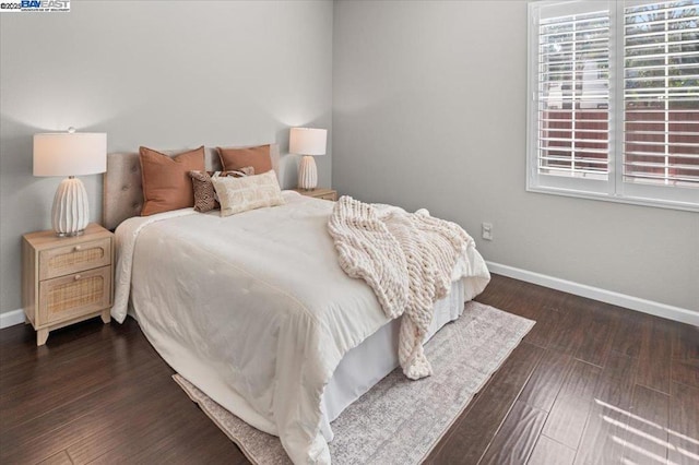 bedroom featuring dark wood-type flooring