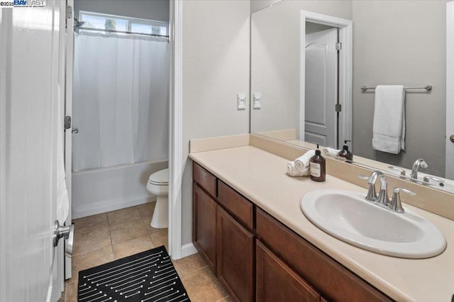 full bathroom featuring vanity, tile patterned floors, toilet, and shower / bath combo