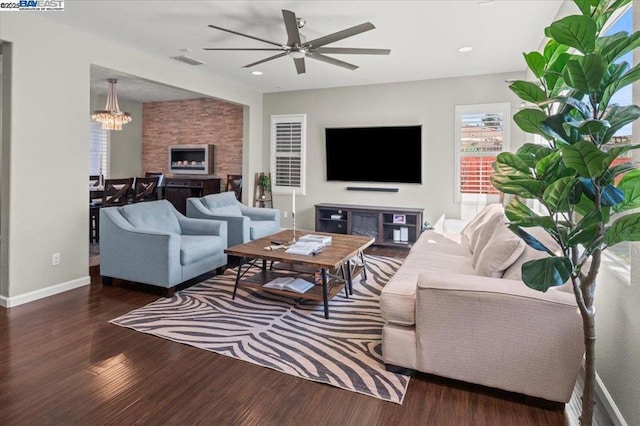 living room featuring dark hardwood / wood-style floors and ceiling fan