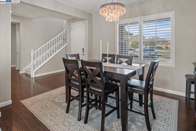 dining room featuring dark hardwood / wood-style floors and a notable chandelier