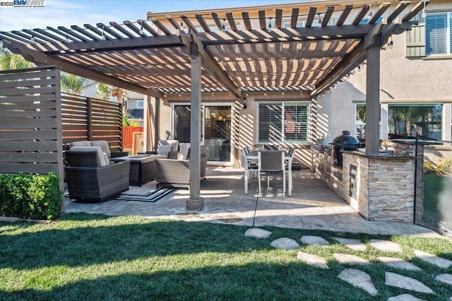 view of patio with exterior kitchen, a grill, an outdoor hangout area, and a pergola