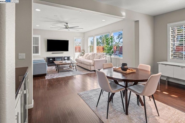 dining space featuring plenty of natural light, dark hardwood / wood-style floors, and ceiling fan