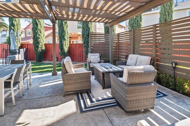 view of patio / terrace featuring an outdoor living space with a fire pit and a pergola