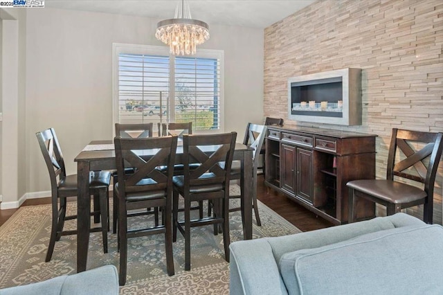 dining room featuring wood-type flooring and a chandelier