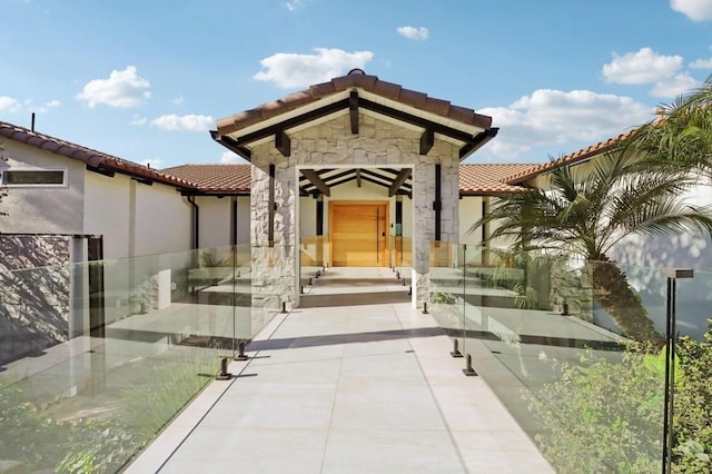 doorway to property featuring a patio