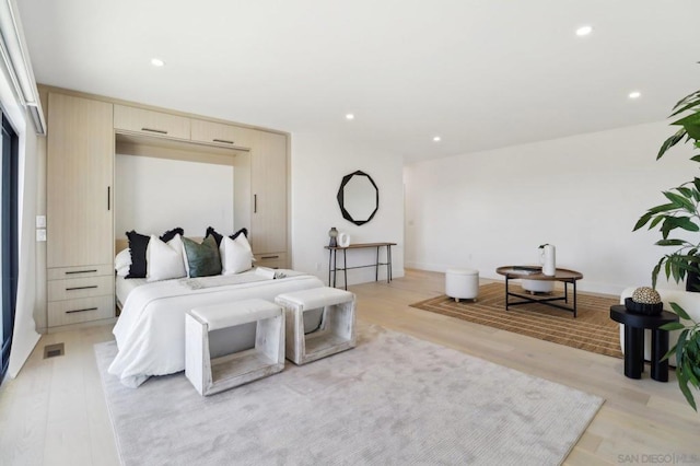 bedroom with light wood-type flooring