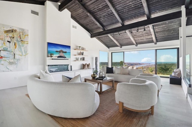 living room featuring wood ceiling, light hardwood / wood-style flooring, high vaulted ceiling, and beamed ceiling