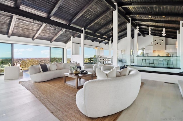 interior space with wood-type flooring, high vaulted ceiling, wood ceiling, and beam ceiling