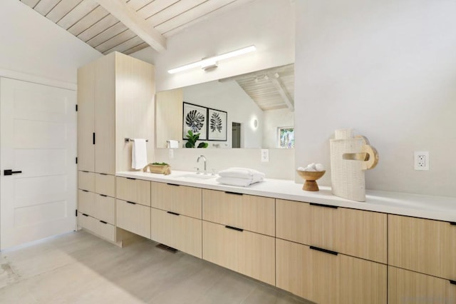 bathroom with vanity, wooden ceiling, and vaulted ceiling with beams