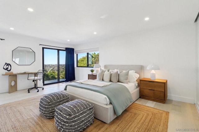 bedroom with access to outside and light hardwood / wood-style floors