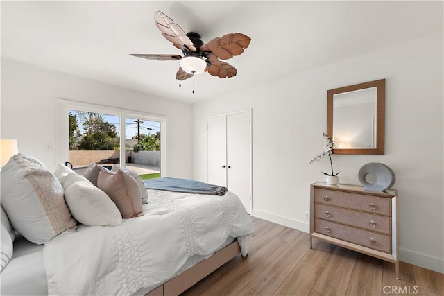 bedroom featuring light hardwood / wood-style floors, a closet, and ceiling fan