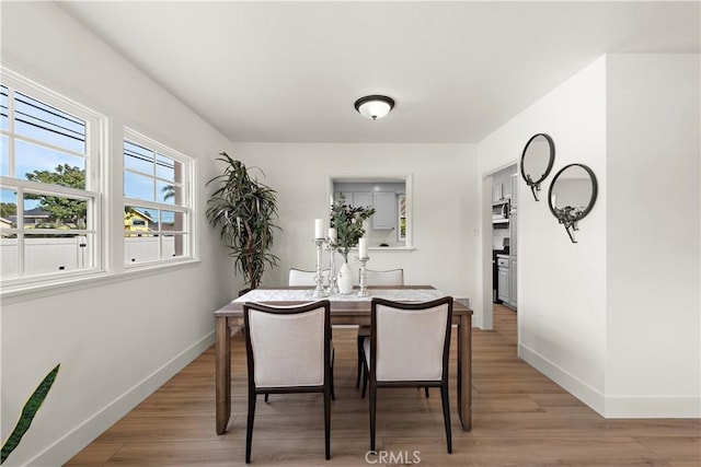 dining room featuring light hardwood / wood-style flooring