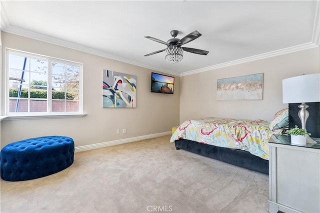 bedroom with a ceiling fan, carpet, ornamental molding, and baseboards