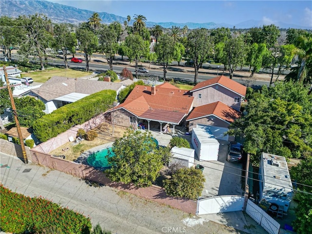 birds eye view of property with a residential view and a mountain view