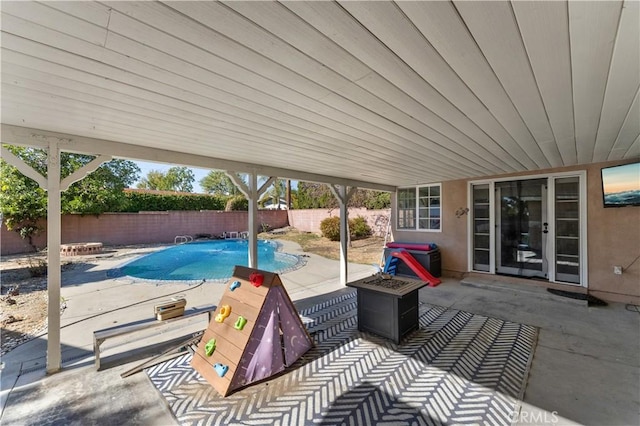 view of patio / terrace with a fenced in pool and a fenced backyard