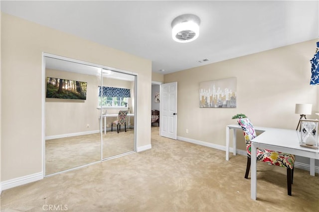 carpeted home office with visible vents and baseboards