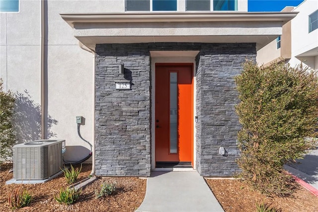 entrance to property featuring central AC unit