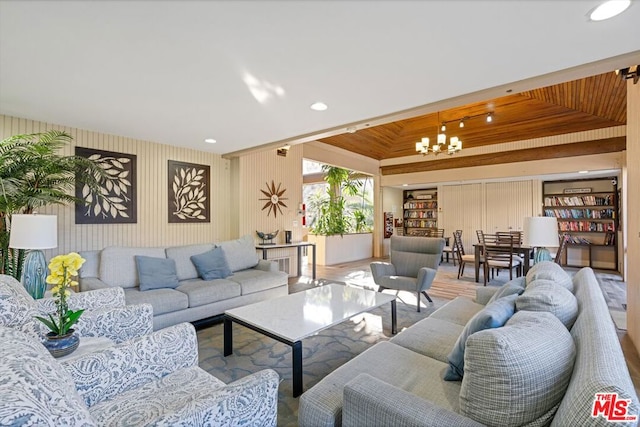 living room featuring wood ceiling and a notable chandelier