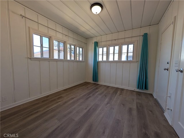 empty room with dark wood finished floors